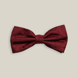 Burgundy silk bow tie with a tonal woven paisley pattern, front view