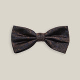 Dark brown silk bow tie with a subtle woven paisley pattern, front view