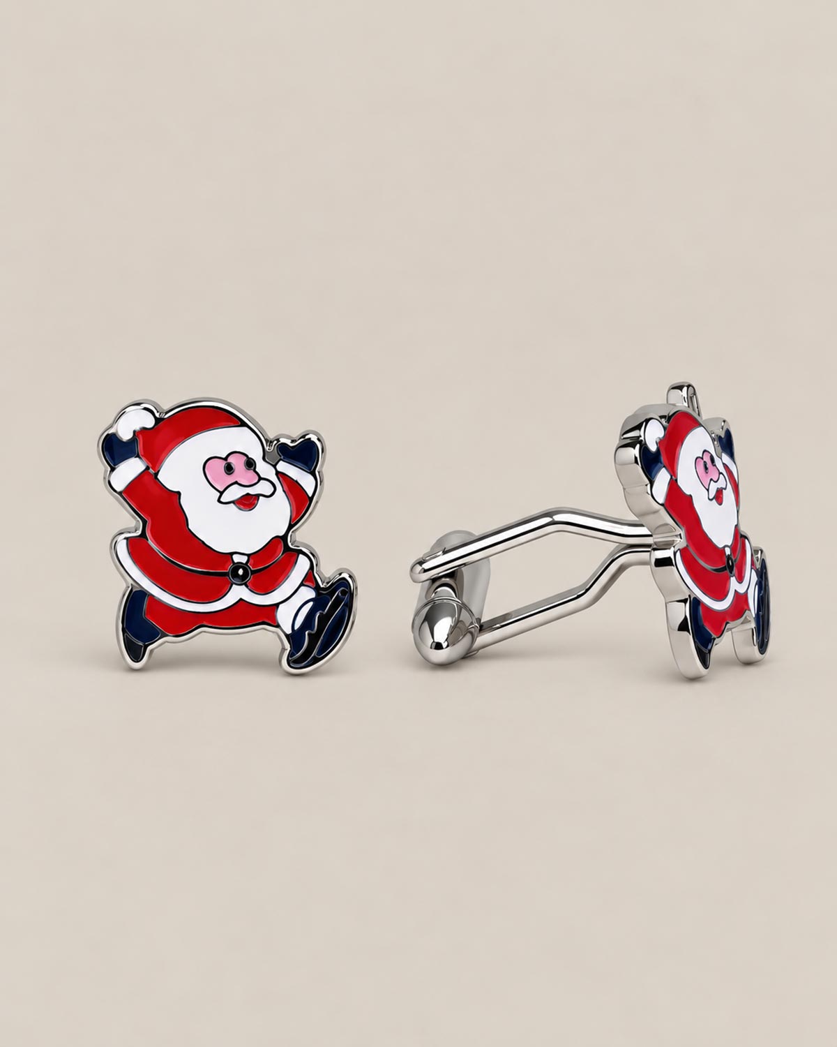 Pair of Santa Claus cufflinks with red and white details, polished silver-tone outlines and T-bar fastenings.