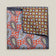 Double-face silk pocket square with rust-red paisley and a brown geometric floral reverse in blue-grey, olive green and ivory.