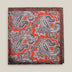 Rust-red printed silk pocket square with large brown, ivory and muted blue paisley motifs and a contrasting brown border.