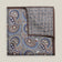 Grey double-face silk pocket square with ornate navy, pale blue, brown and ivory paisley, a small floral medallion reverse and a brown border.