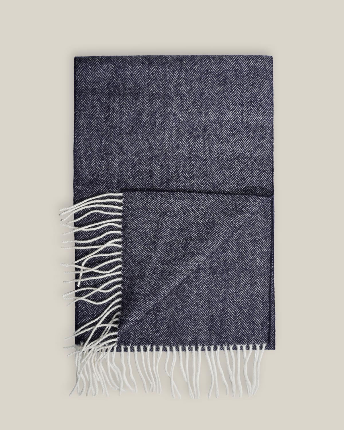 Blue pure wool scarf with a light-toned herringbone pattern and contrasting light fringes