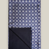 Navy medallion silk scarf with plain navy wool backing and short fringed edges, shown folded