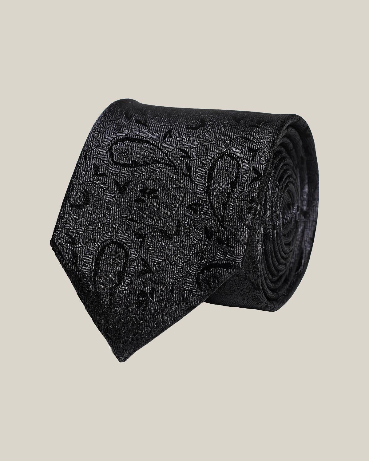 Black paisley 100% silk tie by Stockholm Kravatt, rolled detail view