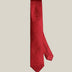 Red paisley silk tie rolled, showing tonal paisley weave detail, by Stockholm Kravatt