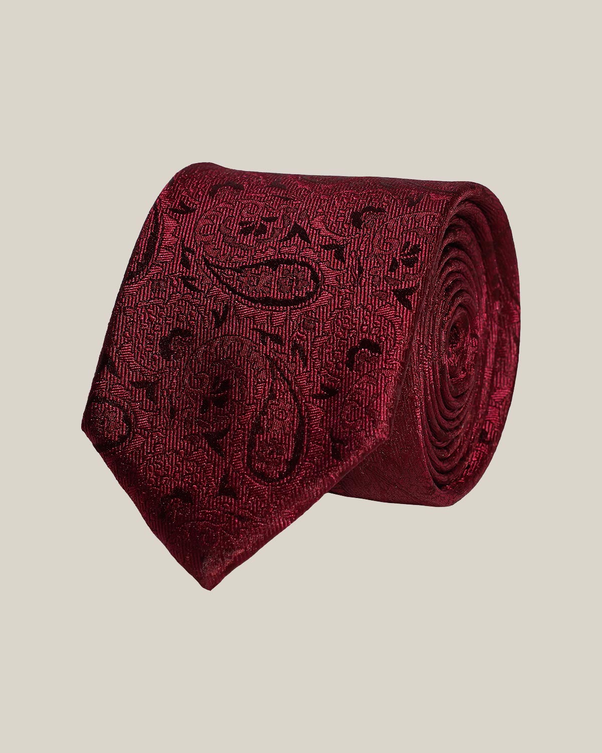 Burgundy paisley 100% silk tie by Stockholm Kravatt, rolled detail view