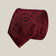 Burgundy paisley 100% silk tie by Stockholm Kravatt, rolled detail view