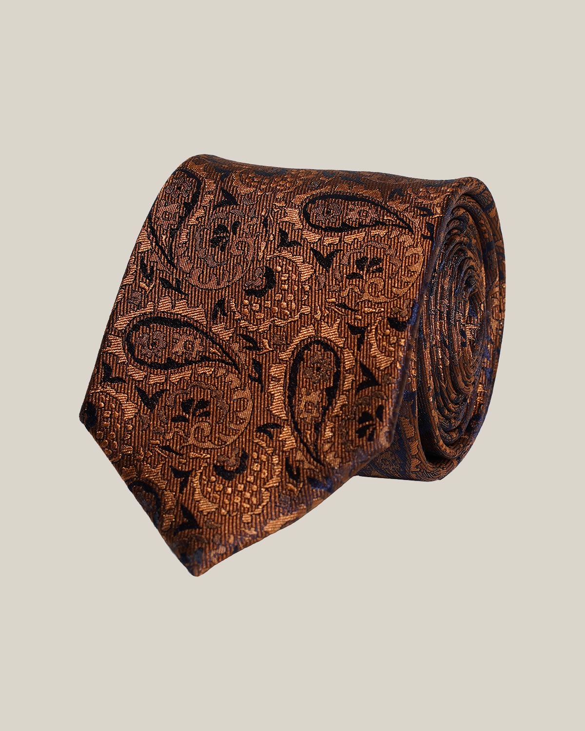 Bronze paisley 100% silk tie by Stockholm Kravatt, rolled detail view