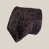 Dark brown paisley 100% silk tie by Stockholm Kravatt, rolled detail view