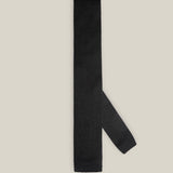 Black knitted tie with a textured surface and classic straight square end
