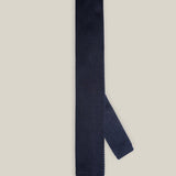 Navy knitted tie with a textured surface and classic straight square end