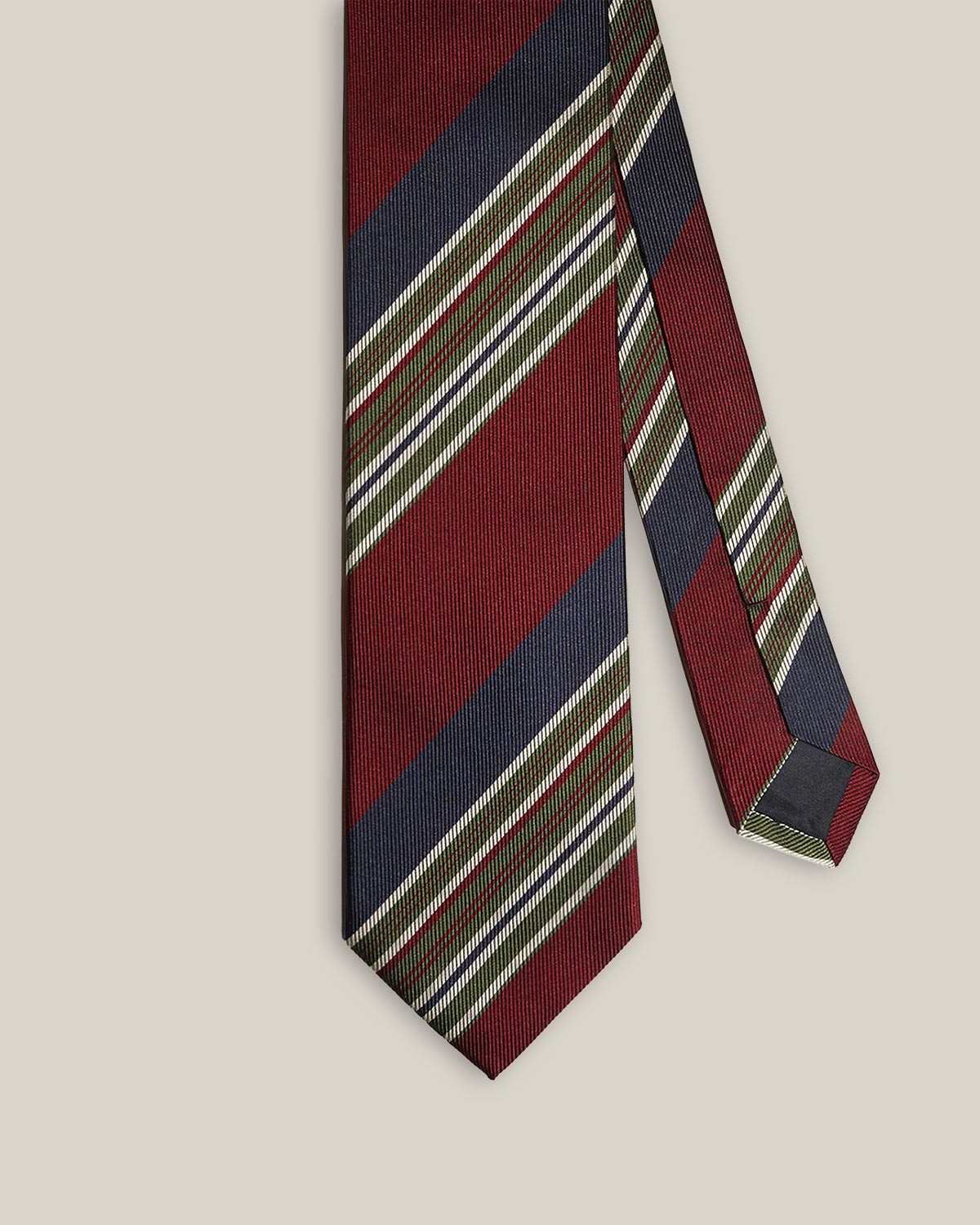 Front detail of burgundy and navy regimental stripe silk tie