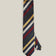 Full view of navy silk tie with yellow, ivory, burgundy and dark green diagonal stripes