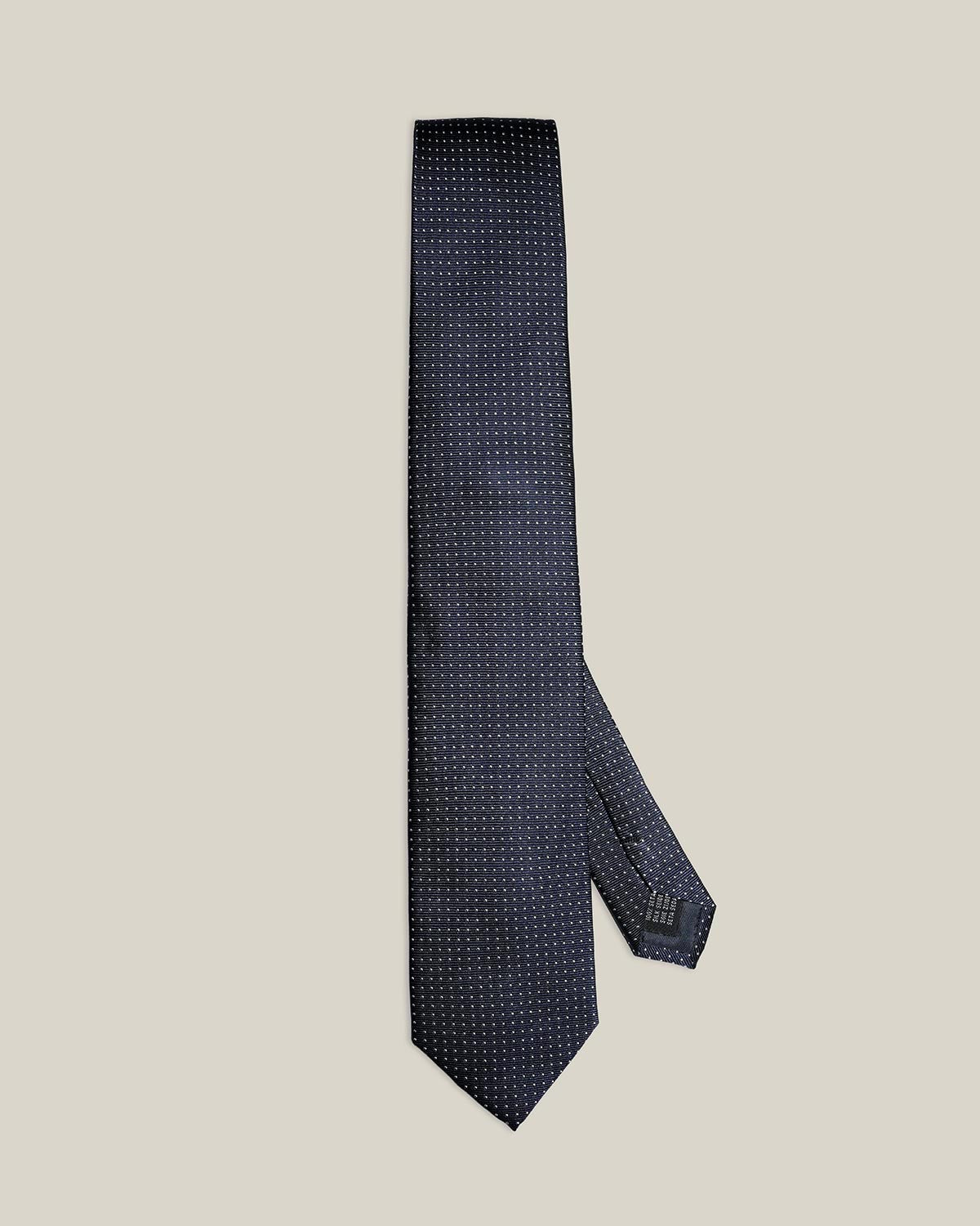 Navy micro-dot 100% silk tie by Stockholm Kravatt, flat lay