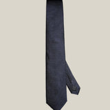 Navy micro-dot 100% silk tie by Stockholm Kravatt, flat lay