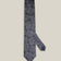 Navy woven silk tie with an intricate all-over silver paisley pattern