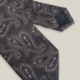 Navy blue woven silk tie with an intricate all-over brown paisley pattern
