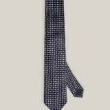 Navy woven silk tie with small light blue floral motifs by Stockholm Kravatt
