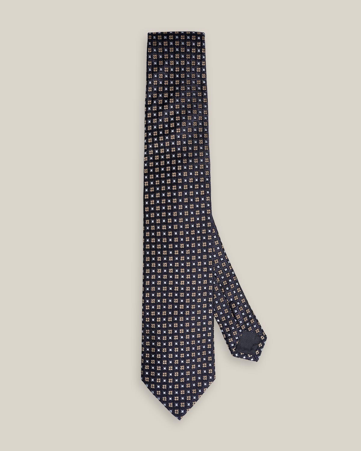 Dark navy woven silk tie with a small silver-toned geometric pattern
