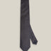 Dark navy woven silk tie with a small silver-toned geometric pattern
