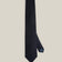 Deep navy woven wool tie with a textured surface and a classic pointed tip.