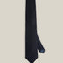 Deep navy woven wool tie with a textured surface and a classic pointed tip.