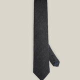 Charcoal grey woven wool tie with a textured surface and a classic pointed tip.