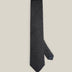 Charcoal grey woven wool tie with a textured surface and a classic pointed tip.