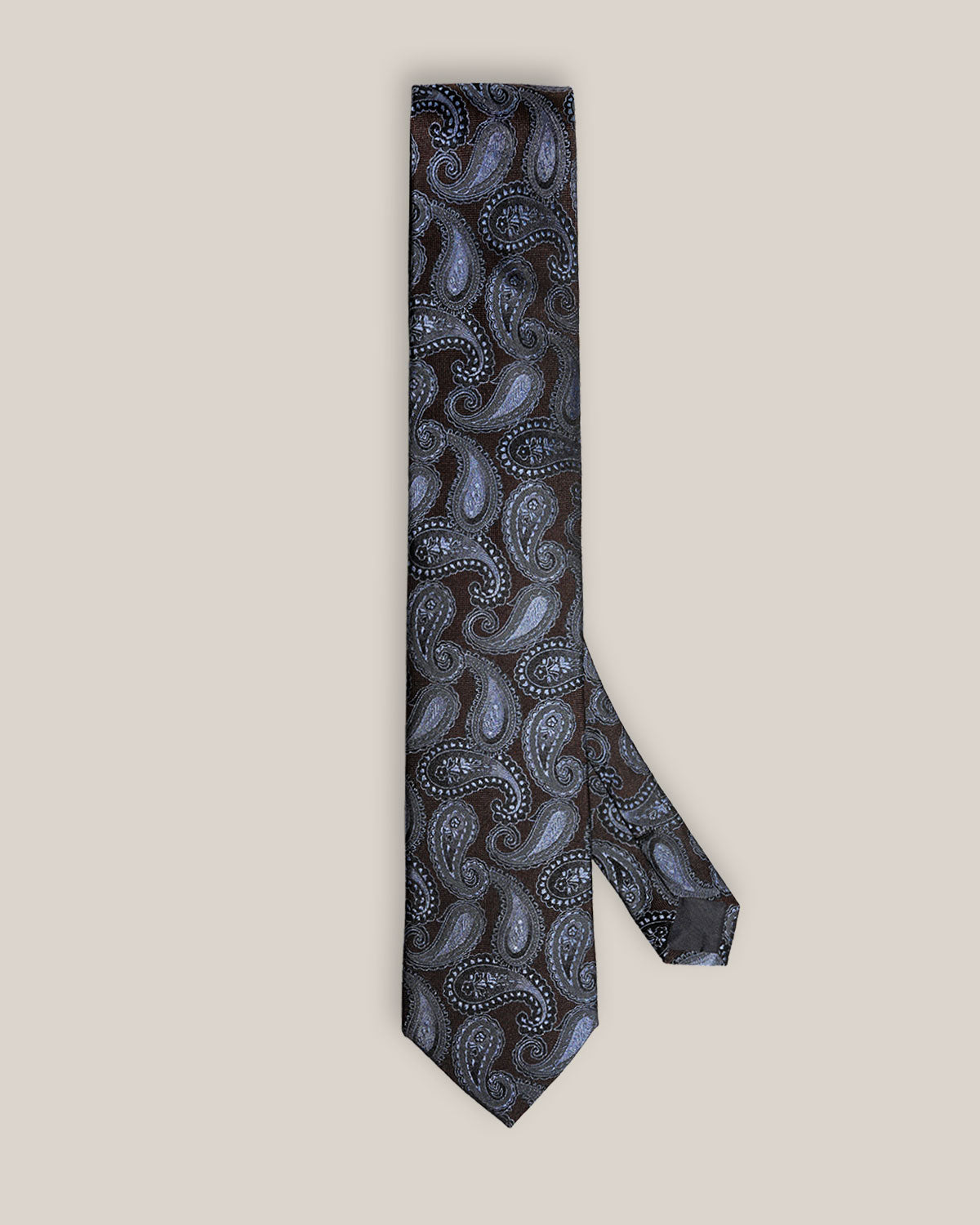 Full view of a dark brown silk tie with light blue and silver paisley motifs.