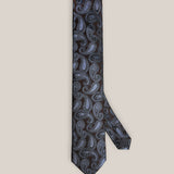 Full view of a dark brown silk tie with light blue and silver paisley motifs.