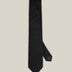 Classic black woven pure silk tie on a light background