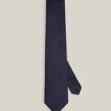 Dark navy woven pure silk tie on a neutral background