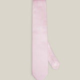 Light pink woven pure silk tie on a neutral background