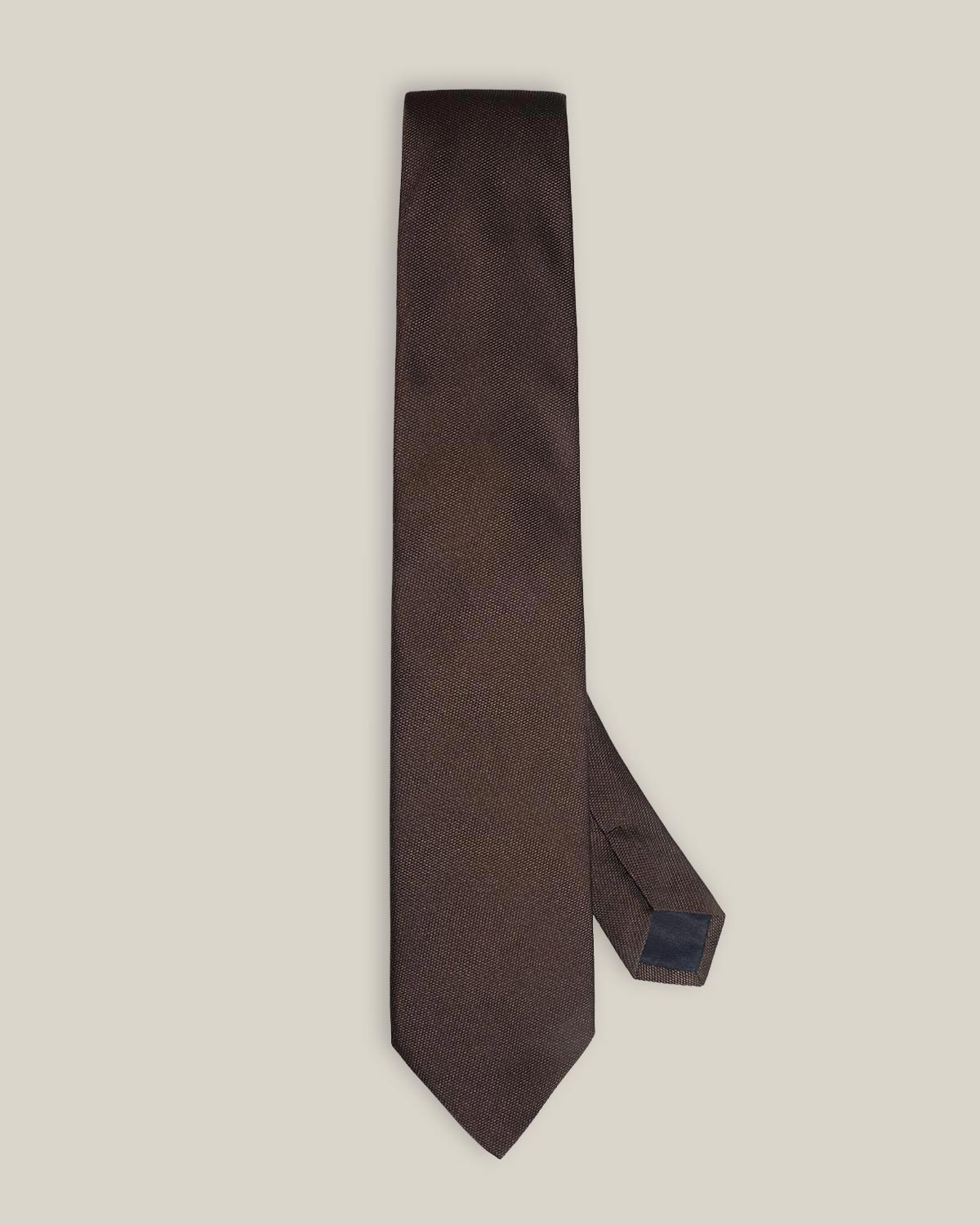 Brown woven pure silk tie on a neutral background