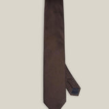 Brown woven pure silk tie on a neutral background