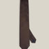 Brown woven pure silk tie on a neutral background