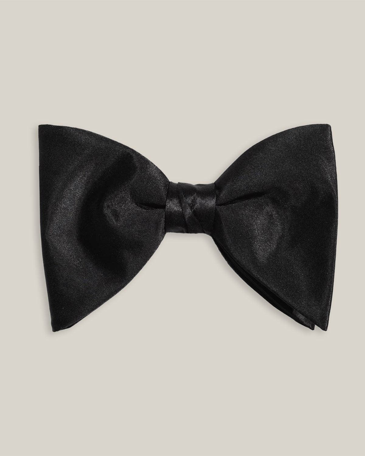 Monte Carlo black silk bow tie by Stockholm Kravatt, flat lay