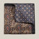 Double-face 100% silk pocket square showing brown paisley on one side and blue geometric floral pattern on the other