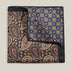 Double-face 100% silk pocket square showing brown paisley on one side and blue geometric floral pattern on the other